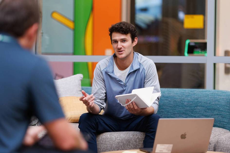 A young professional has a meeting with a colleague in a Meta office in New York City.