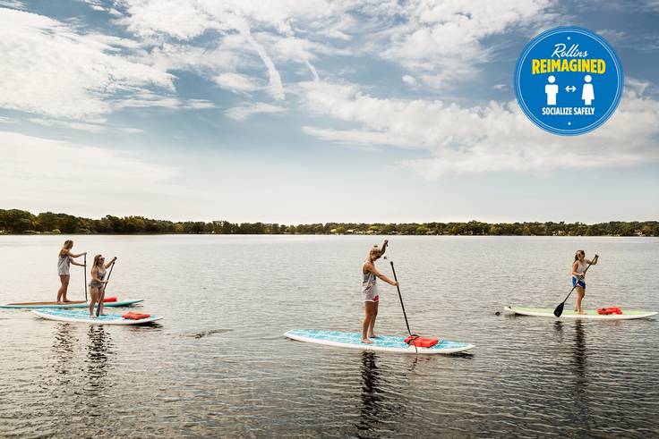 Students paddleboarding on Lake Virginia.