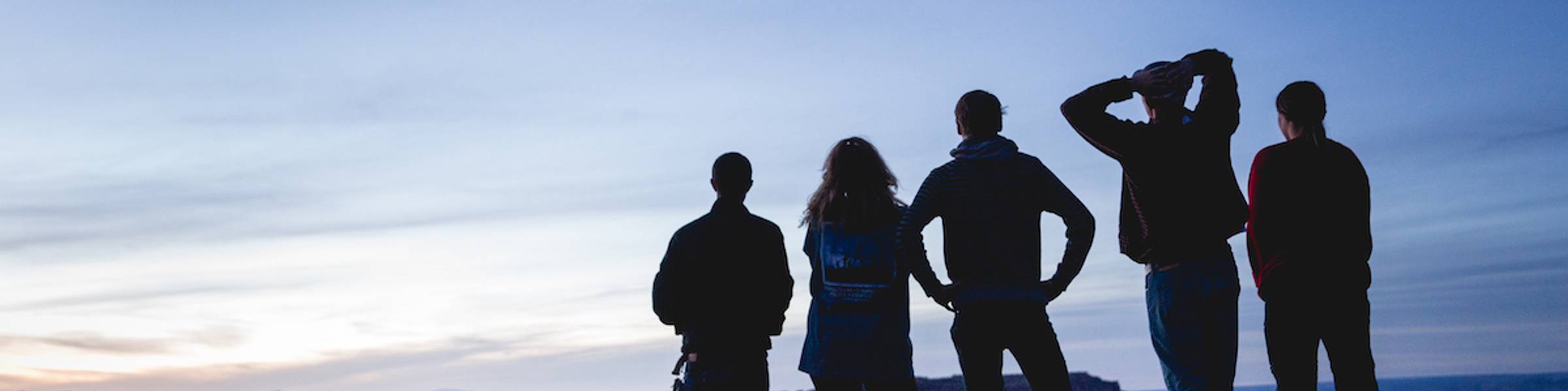 Students looking out at the sunrise during a Moab, Utah Alternative Spring Break