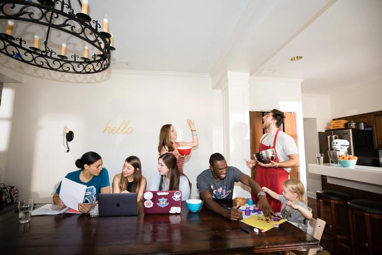 College students hang out in their professor’s unit in Rollins’ Ward Hall.