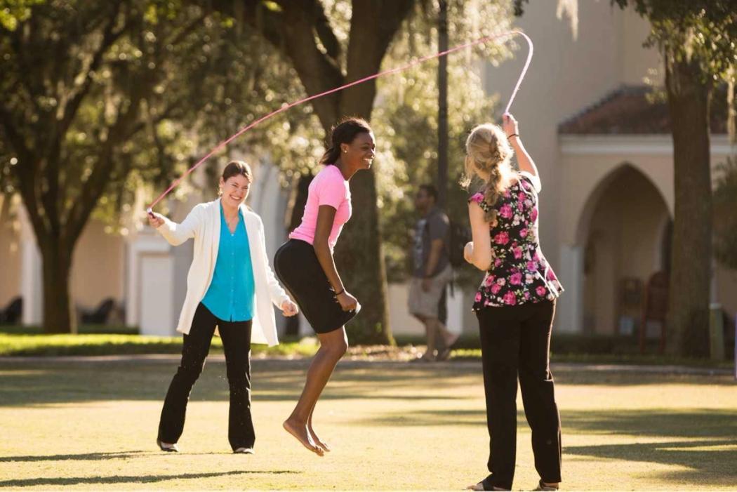 Rollins community members playing jump rope.