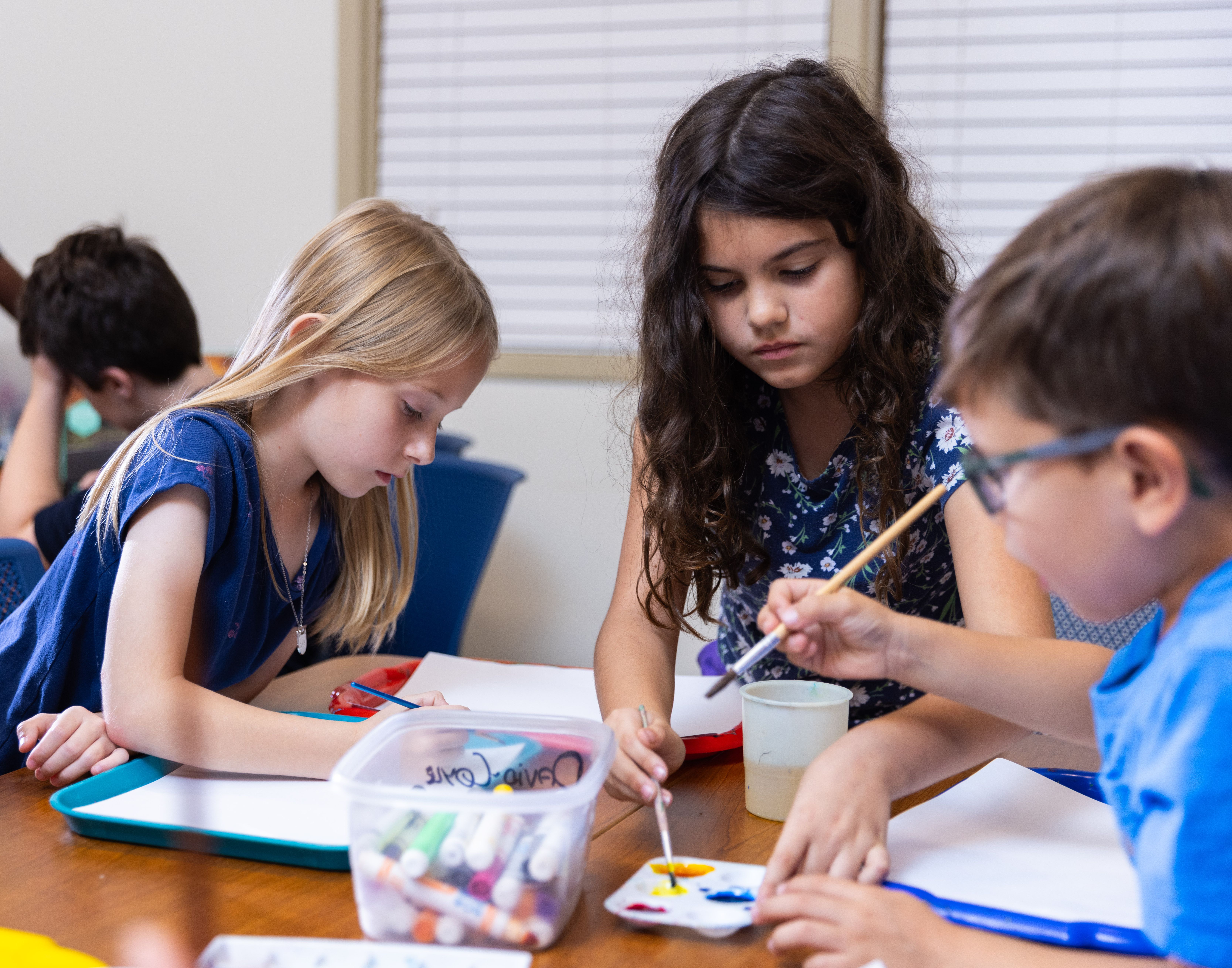 Children complete an art project during Evening Educare.