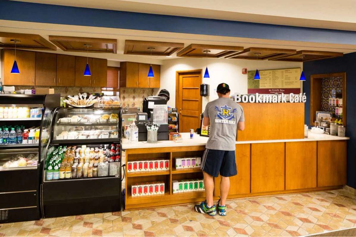 Student getting coffee at the Bookmark Cafe inside Olin Library.