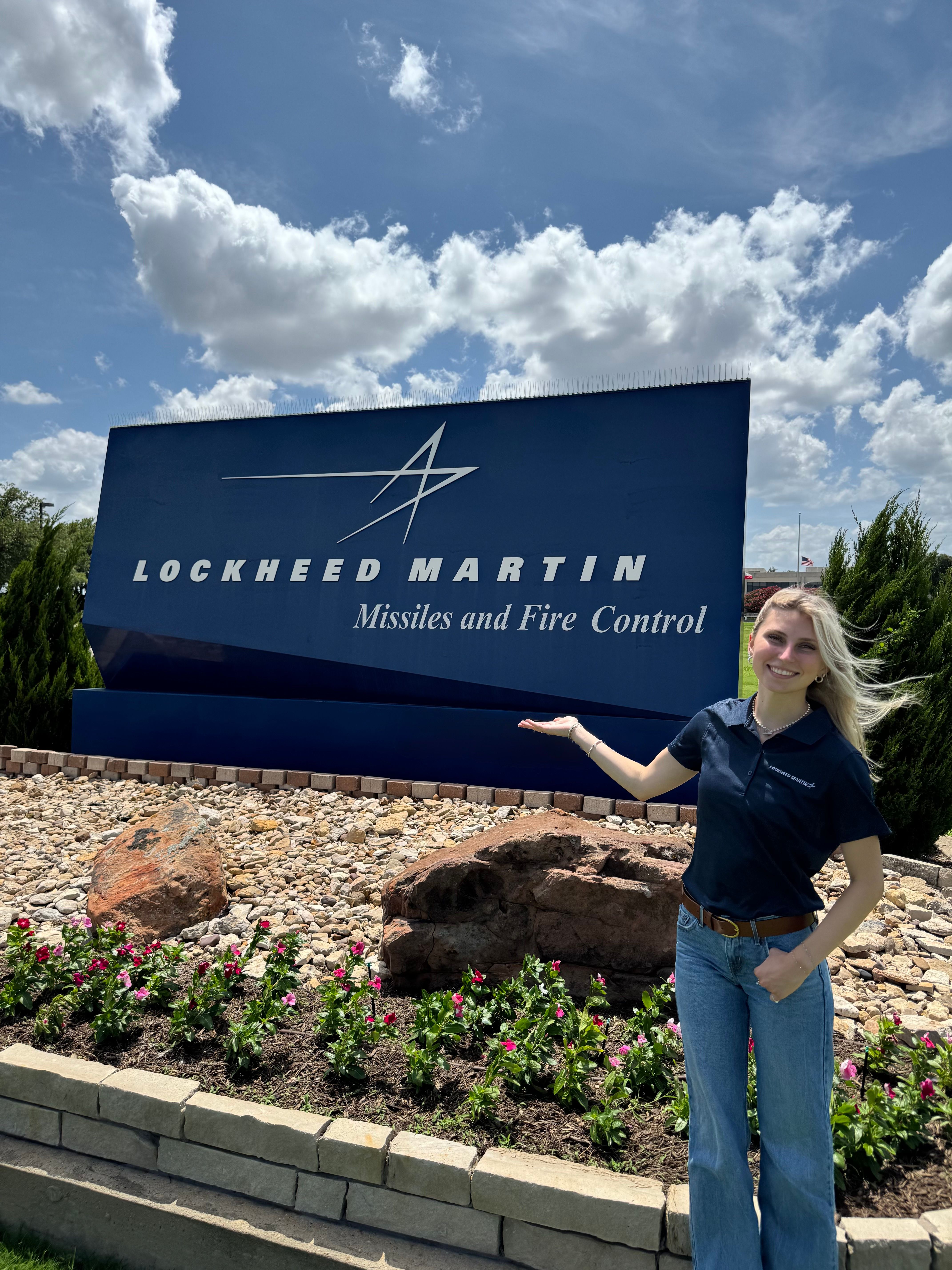 Student poses outside at Lockheed Martin.