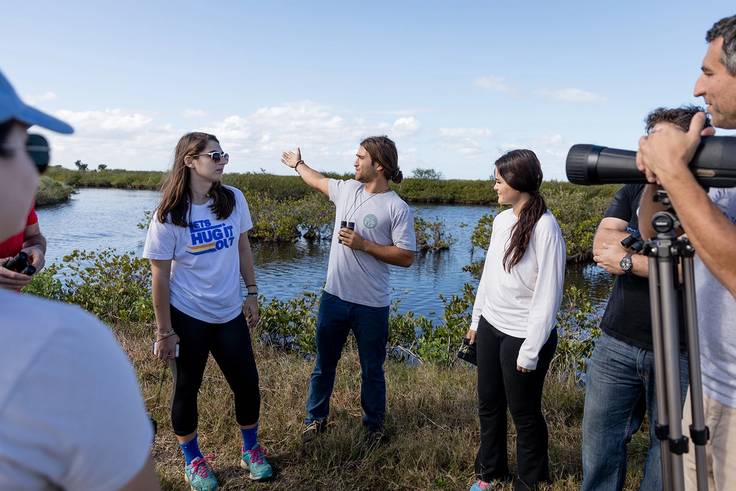Rollins students observing wildlife on a field study.