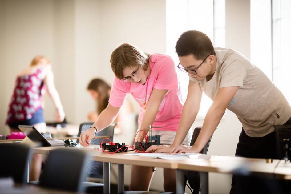 Students in the middle of a physics experiment.