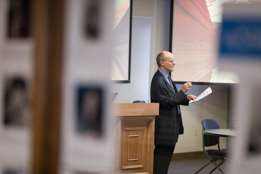 International business professor gives a lecture on finance.