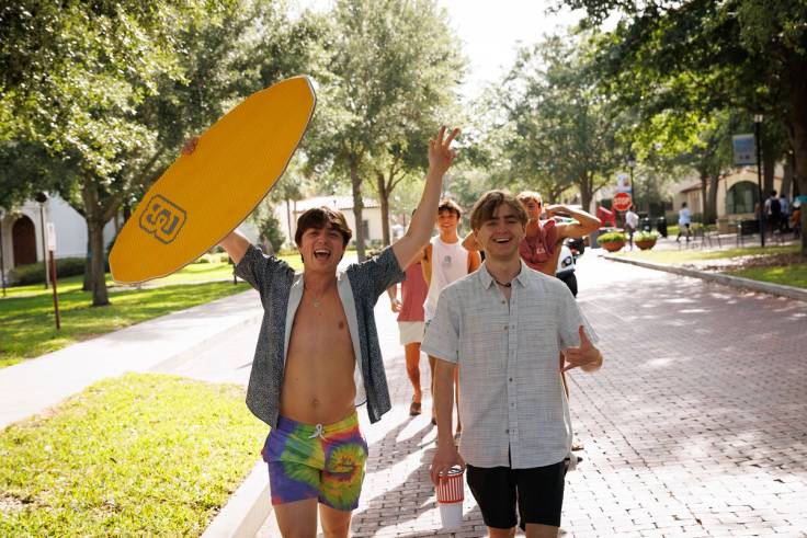 Rollins students head to the beach on Fox Day.
