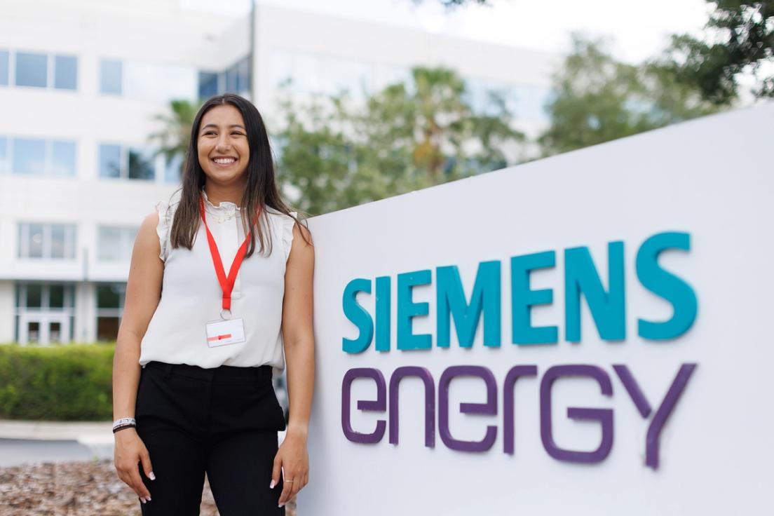 Angelina Khourisader standing in front of Siemens Energy, where she worked as a supply chain finance intern.