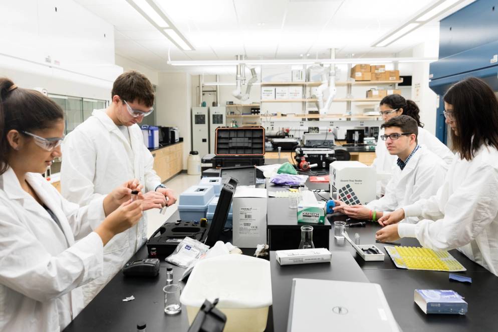 Chemistry students practice water testing in the lab before embarking on a field study to the Dominican Republic.