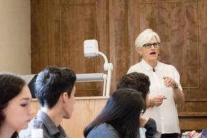Political science professor Joan Davison facilitates a simulation of the U.S. National Security Council during her Globalization RCC course.
