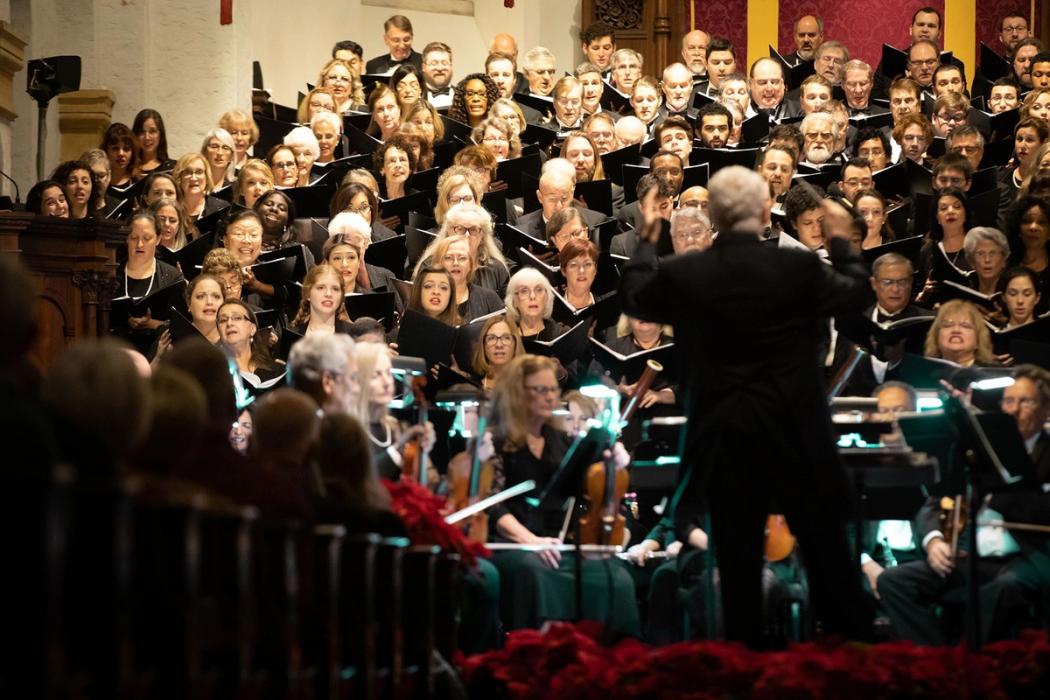 Rollins student orchestra and choire perform in the Knowles Memorial Chapel.