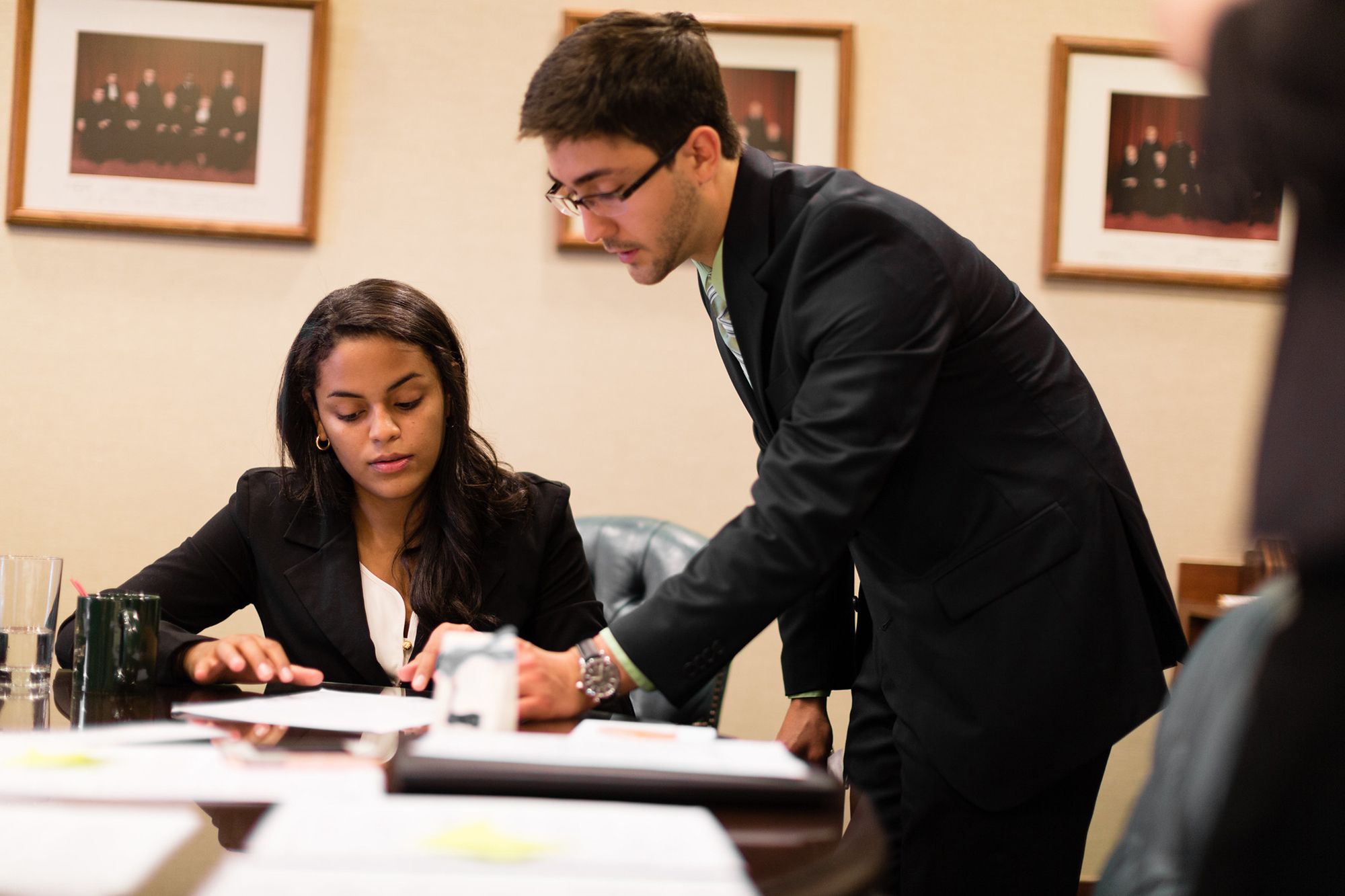 Two students prepare to present a grant proposal.