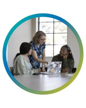 Amy Armenia, Ciara Bibbs, & student interacting 