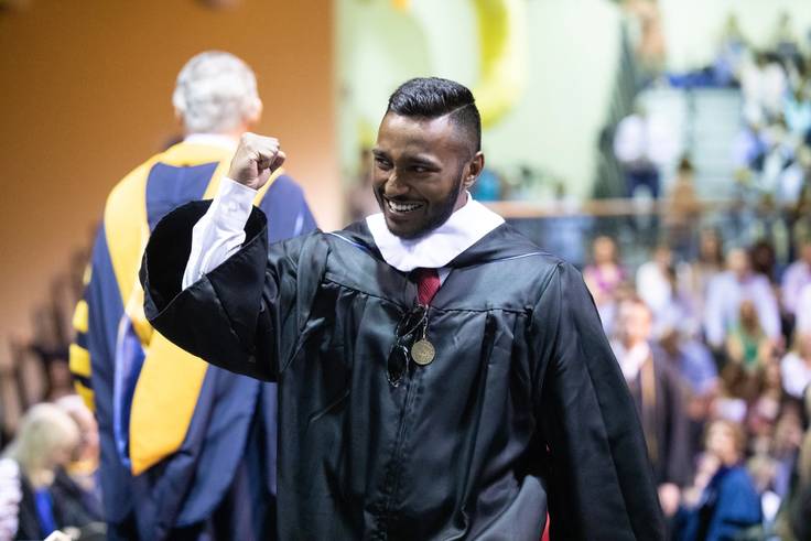 A student celebrates graduating.