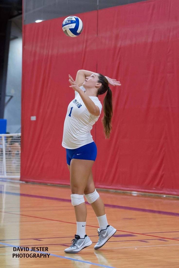 Becca Wilson’18 spikes a volleyball in practice.