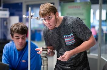 Students explore physics concepts in The Science of Superheroes class.