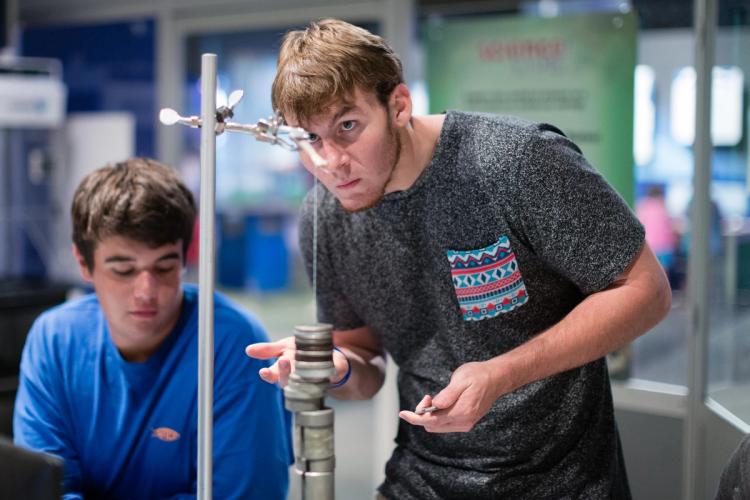 Students explore physics concepts in The Science of Superheroes class.