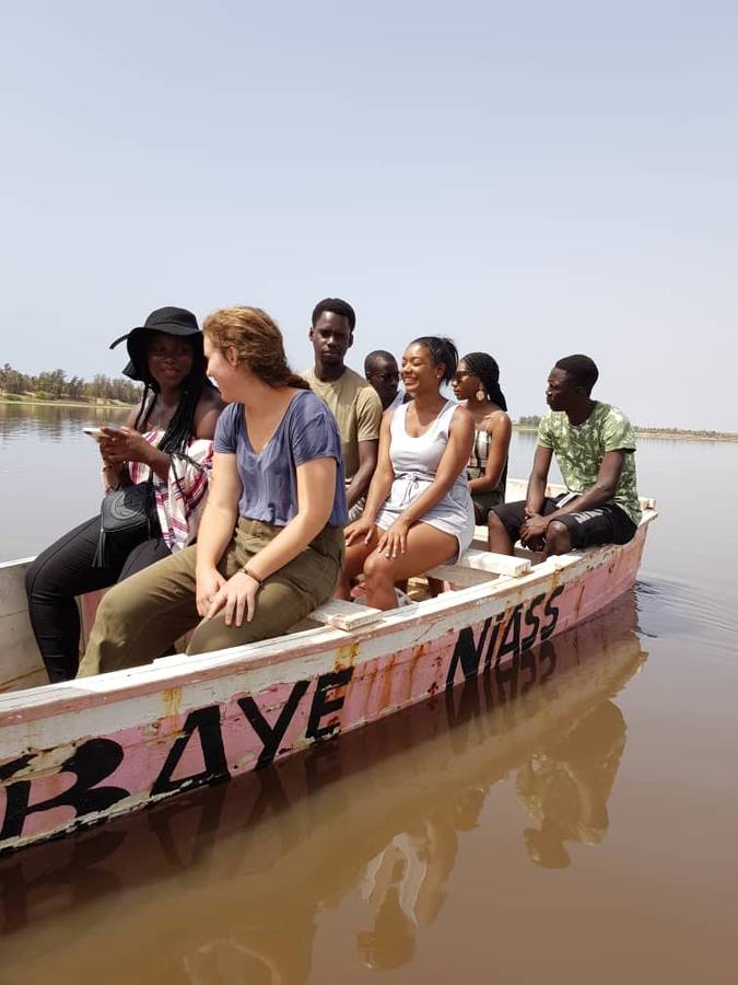 Yaya Mbengue on a boat tour in Senegal, Africa, with locals and fellow interns.