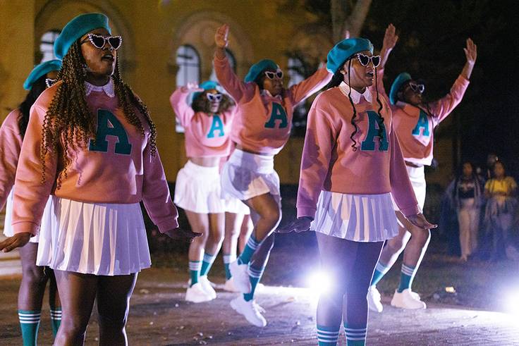 Alpha Kappa Alpha Sorority chartering event, where sisters perform a step routine.