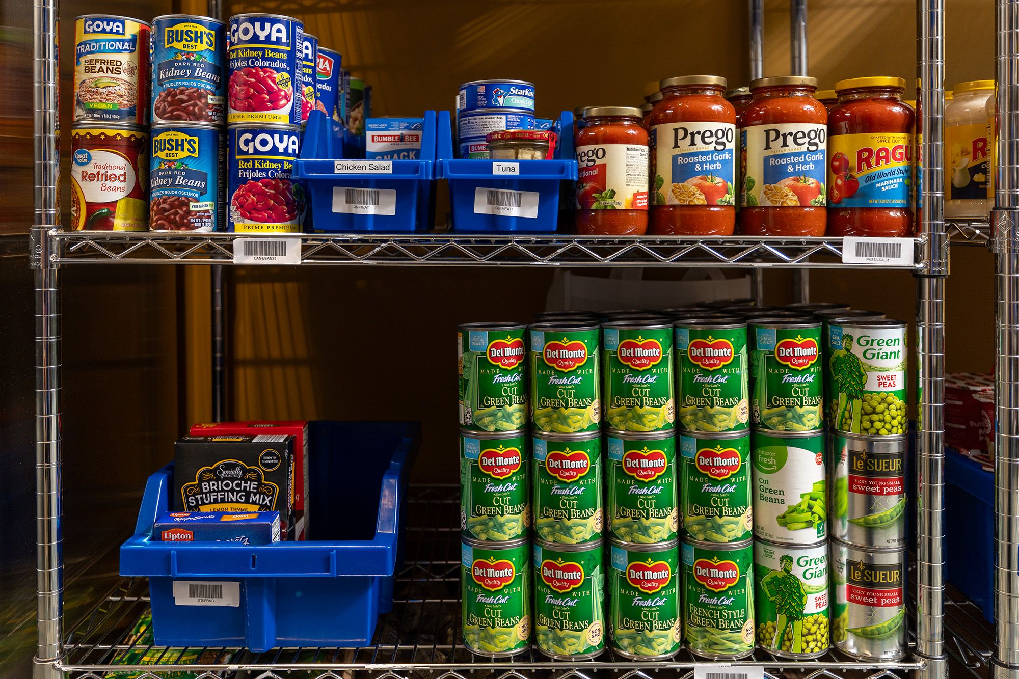 Shelf of jars and cans in food pantry