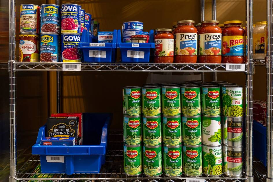 Shelf of jars and cans in food pantry