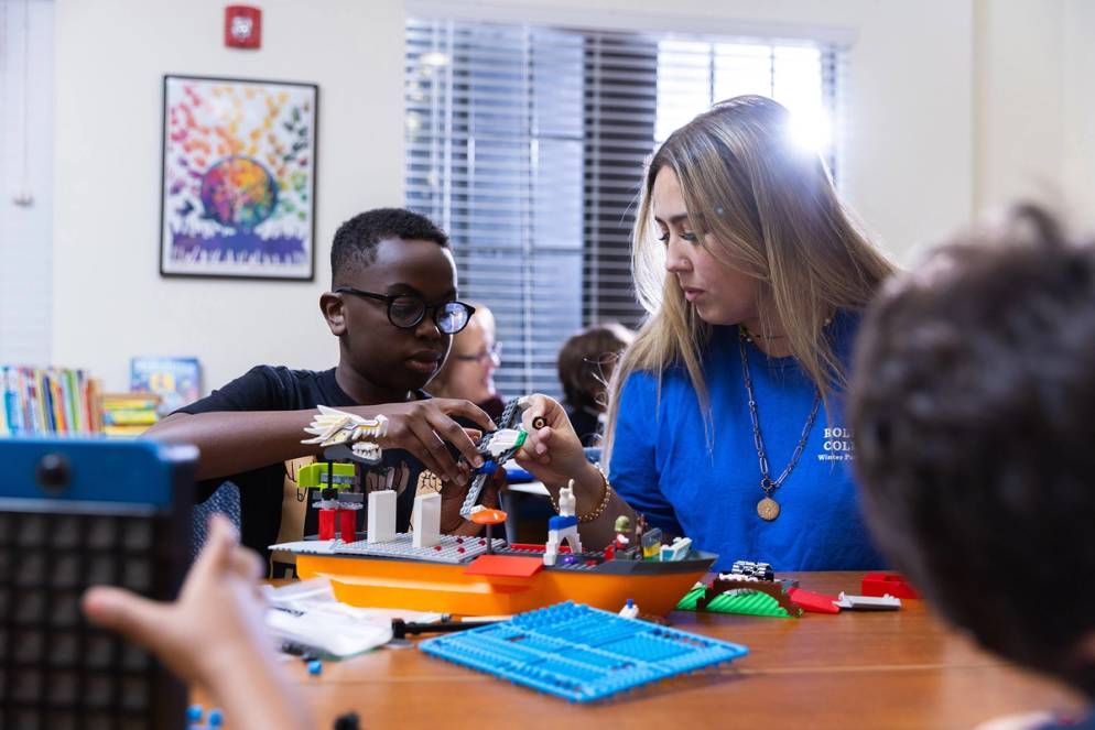 A child and teacher playing an educational game at the Hume House Child Development & Student Research Center