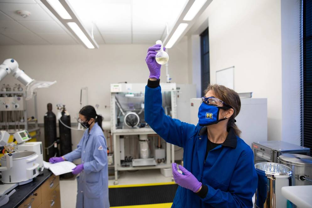 A professor and student conduct chemistry research.