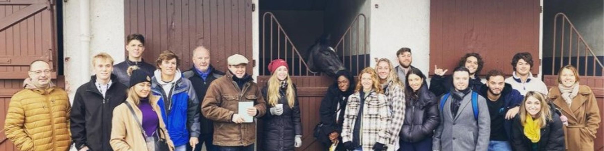 A group of Rollins College students pose outside the Louvre in Paris.