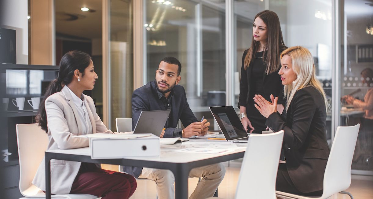 Graduate students brainstorm ideas for a group project.