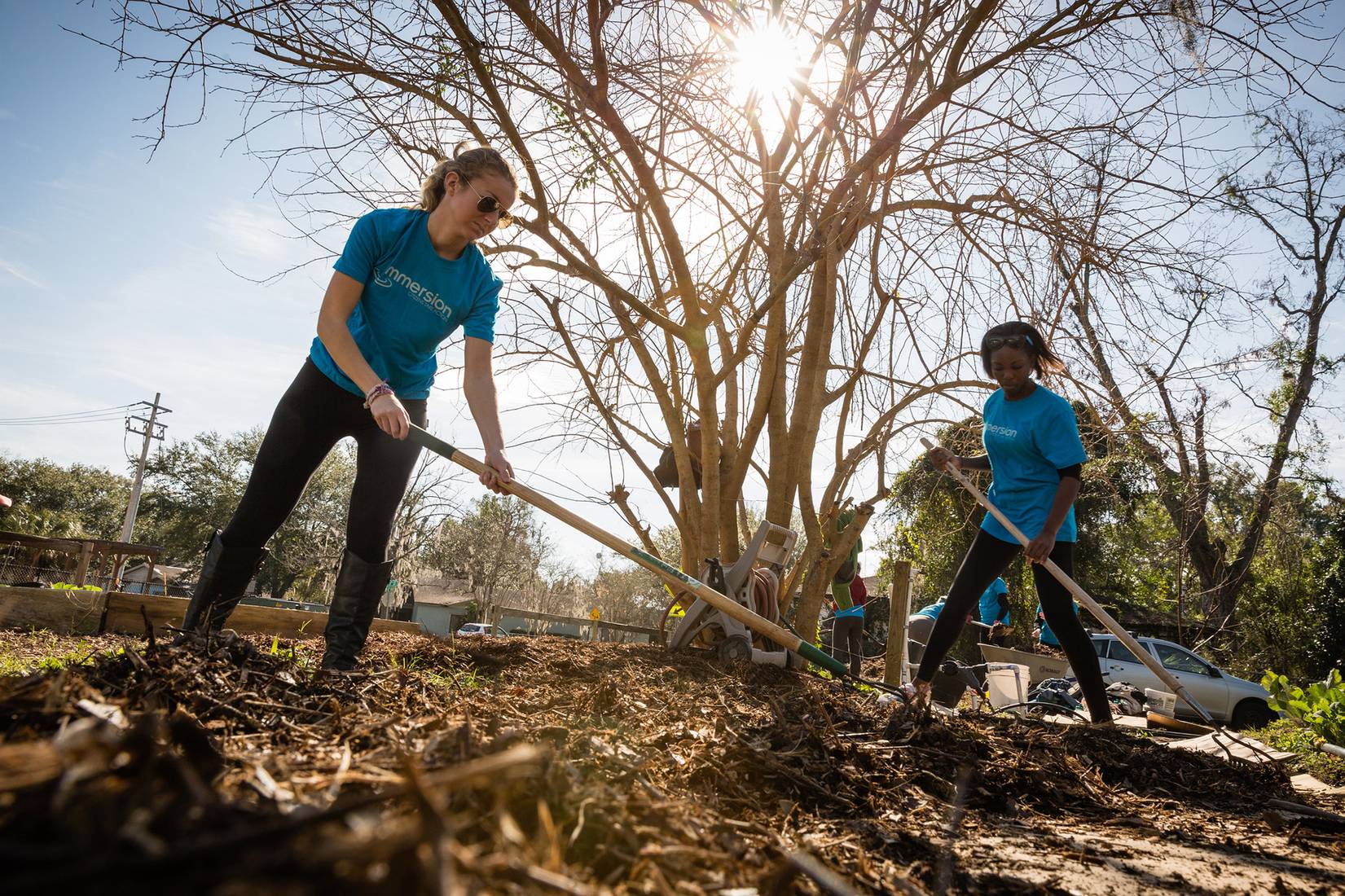 Students tilling the soil during an Immersion experience in Gainesville, Florida.