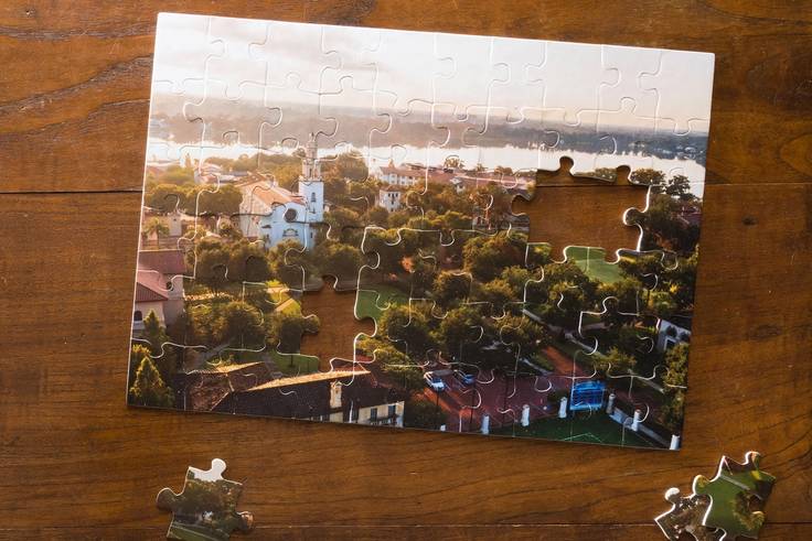 an almost completed puzzle featuring the Rollins campus