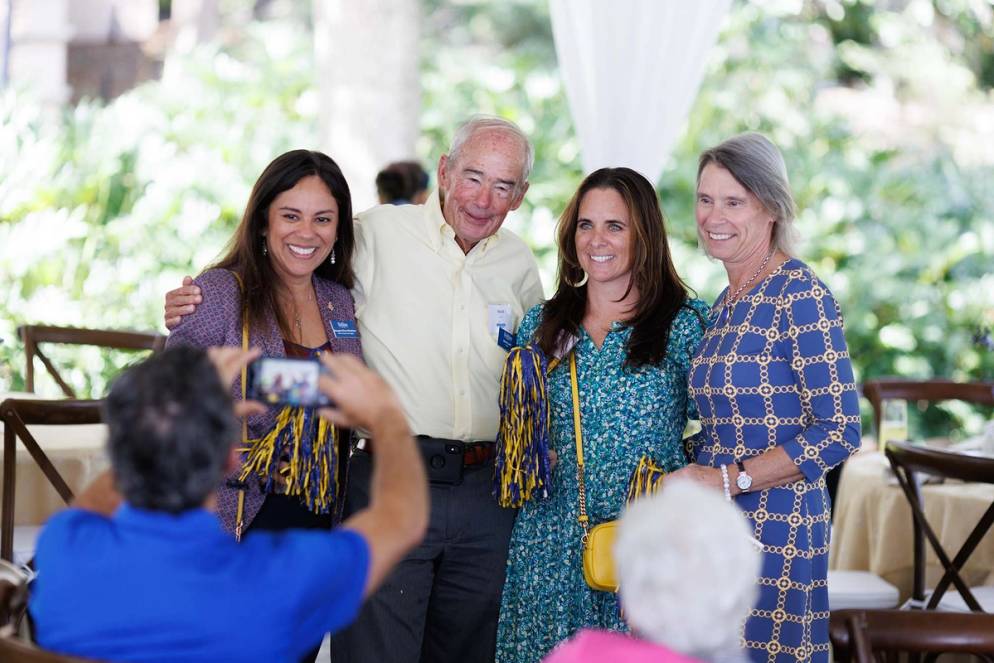 Guests at Rollins' Brighter Together campaign kick-off pose for photos.