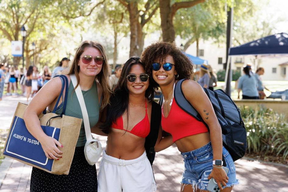 Three students pose for a photo on Fox Day.