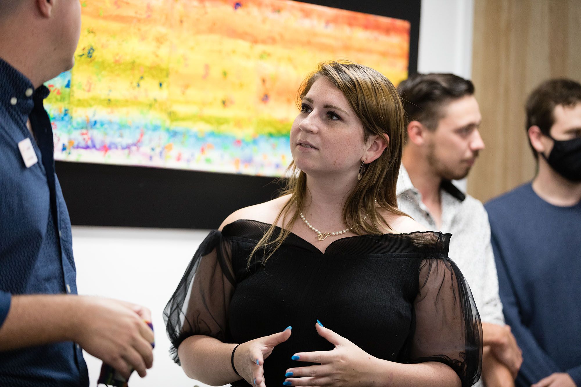 Devorah Burgess engages with guests at her museum exhibition at The Center Orlando.