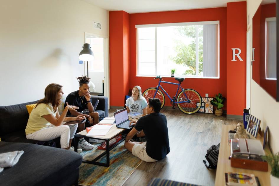 students hanging out in their Lakeside living room