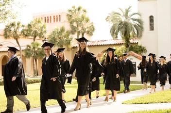 Rollins commencement walk in front of Knowles Memorial Chapel.