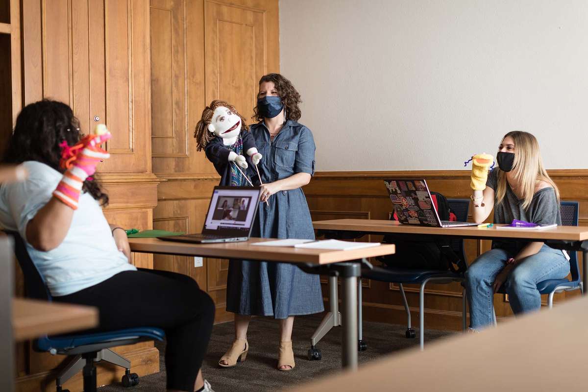 Students participate in a puppet making workshop with professor Sarah Parsloe
