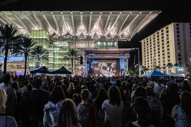 A large crowd watches a performance at the Dr. Phillips Center in downtown Orlando.