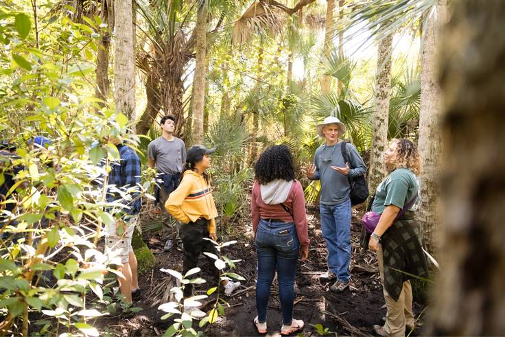 Environmental studies professor Barry Allen leads students on a field study at Canaveral National Seashore.