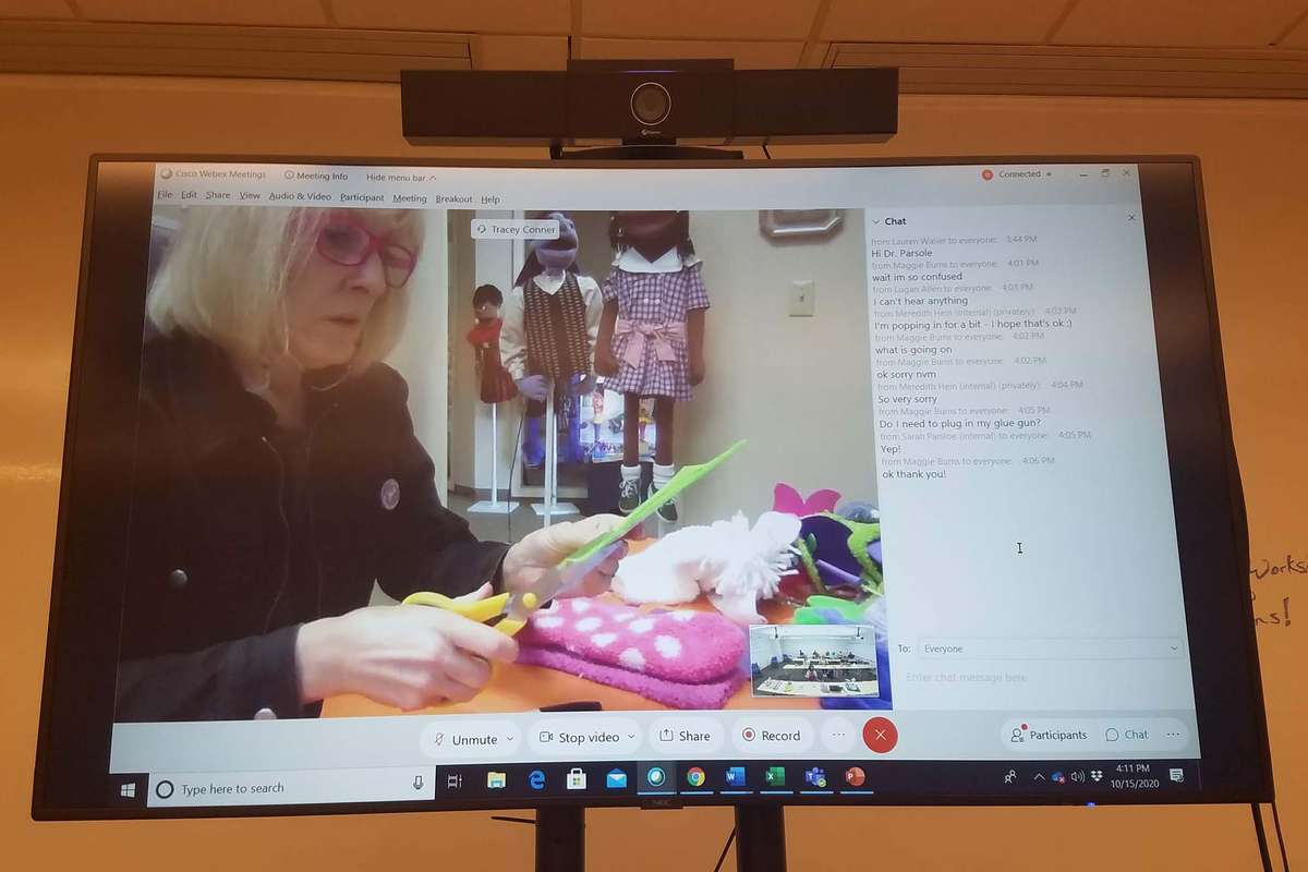 A representative from Michelee Puppets leads a virtual puppet making workshop