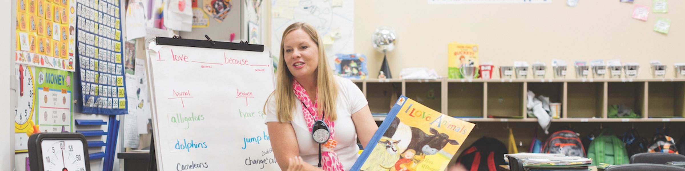 A teacher reads to elementary school students.