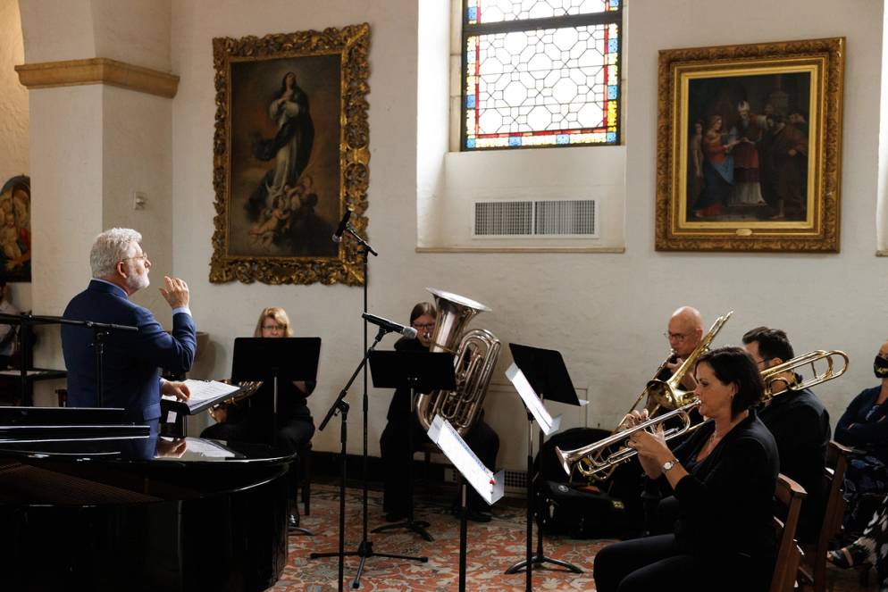 Music professor John Sinclair conducting the orchestra.