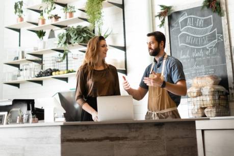 A communication studies student consults with the owner of a farm-to-table startup.