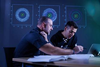 Physics perform acoustical research with lasers in Rollins’ anechoic chamber.