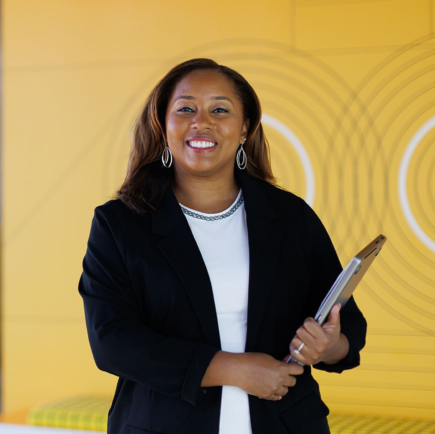 Tiffany Jones, a Rollins Professional Advancement grad, poses for a photo at Google’s Atlanta office.