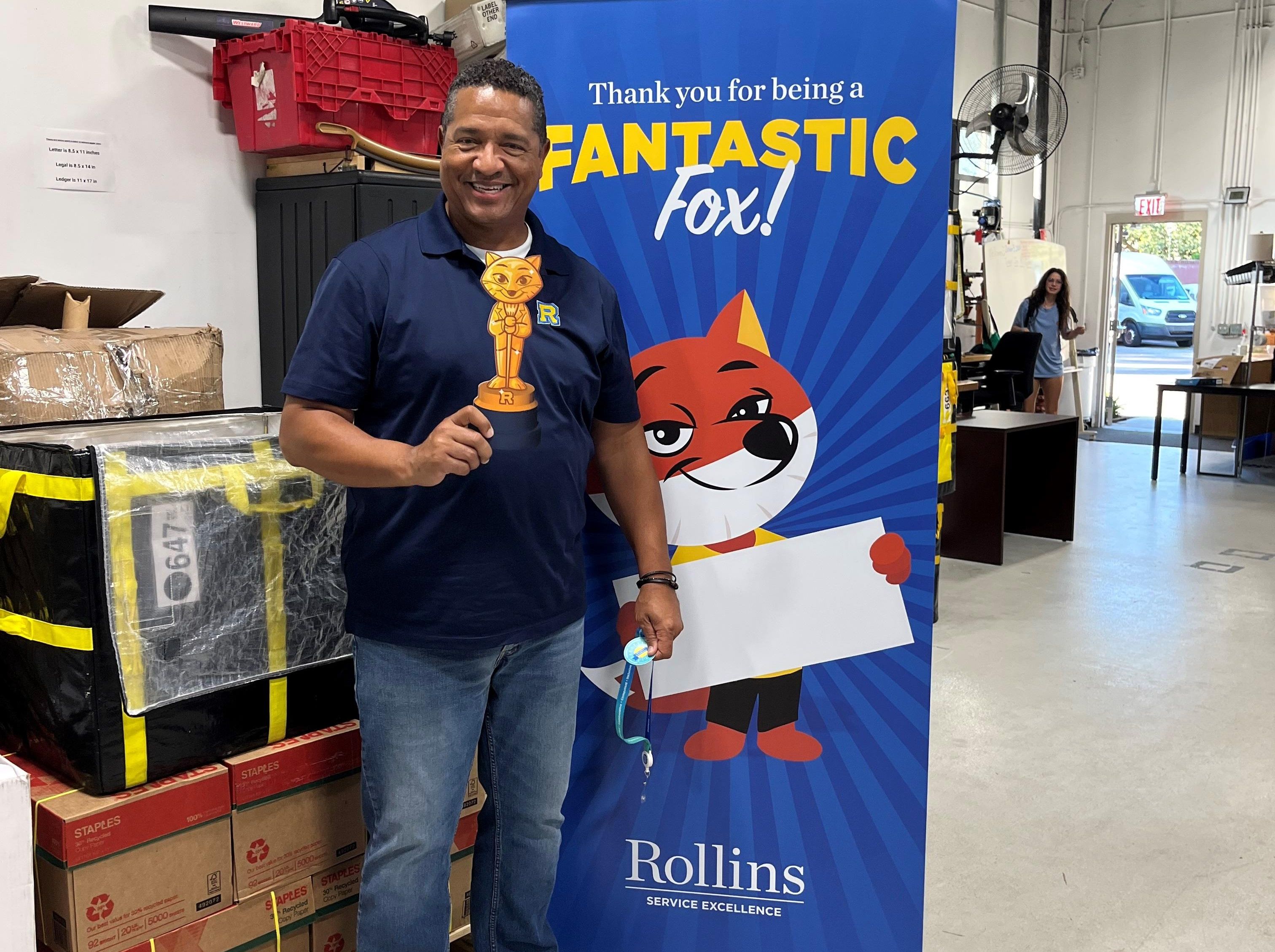 Sterling Bales posing with Service Excellence Departmental Award