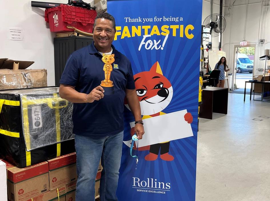 Sterling Bales posing with Service Excellence Departmental Award