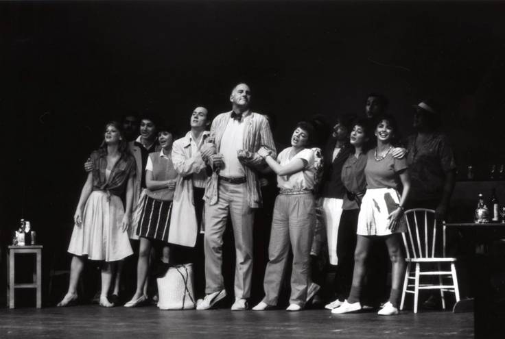 Thad Seymour performs on the Annie Russell Theatre stage with a group of students.
