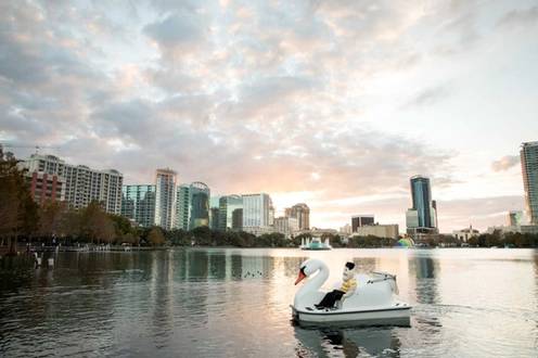 Tommy Tar in a swan boat on Lake Eola.